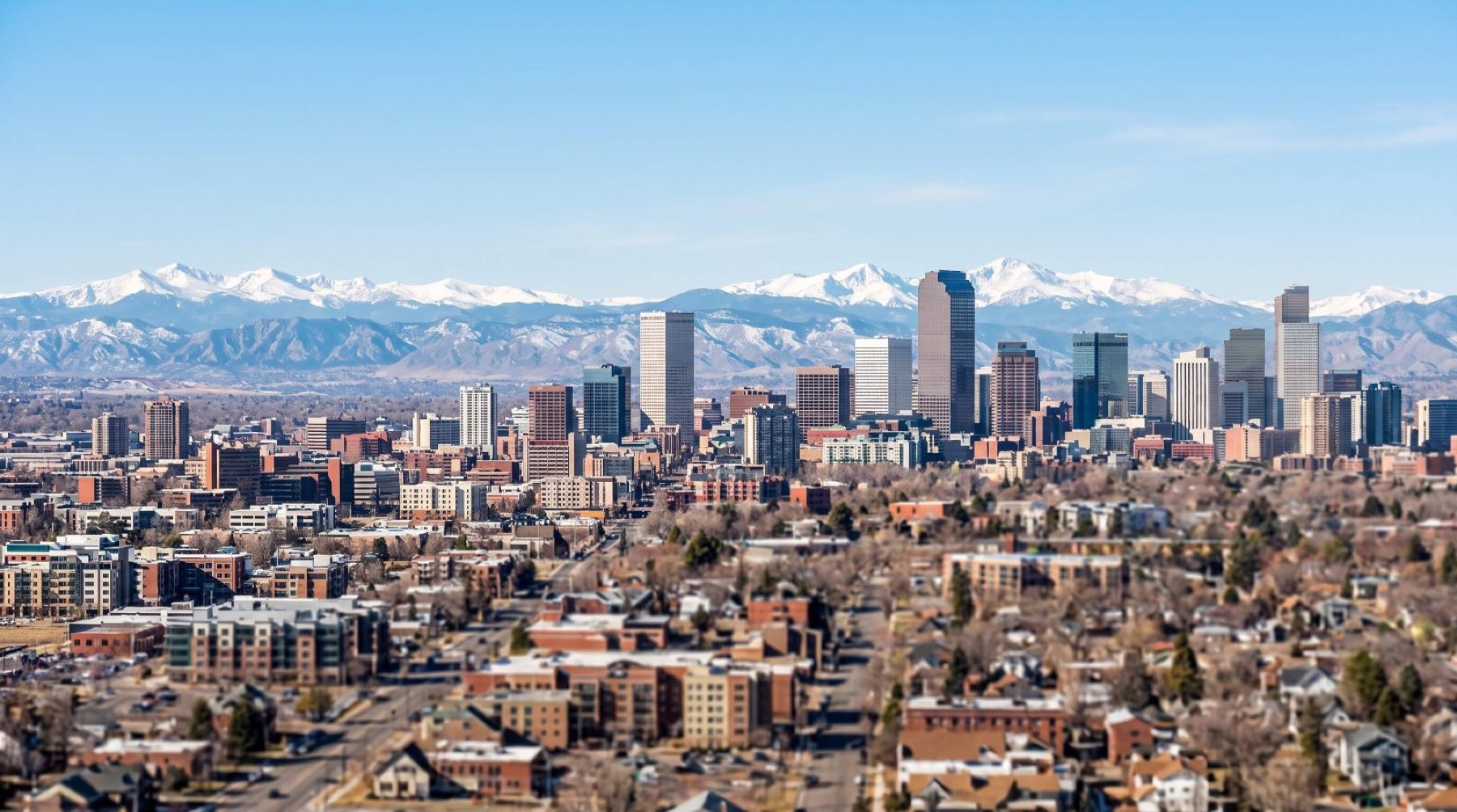 The Denver skyline with the Front Range behind it